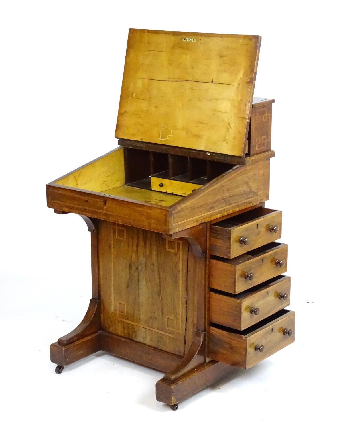 A mid / late 19thC walnut davenport with two banks of three short drawers together with a central - Bild 7 aus 8