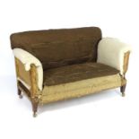 An early 20thC drop end sofa for re upholstery, raised on squared tapering leg and terminating in