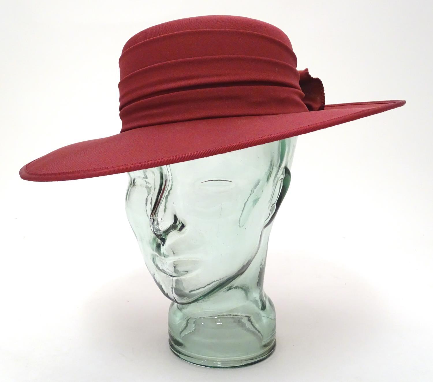 A ladies red hat by Kangol Please Note - we do not make reference to the condition of lots within