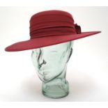 A ladies red hat by Kangol Please Note - we do not make reference to the condition of lots within