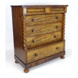 A mid 19thC mahogany north country chest of drawers comprising two short cushion drawers over four