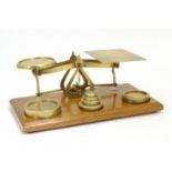 A set of Victorian brass postal scales with six graduated weights. Approx. 10" long Please Note - we