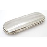 A silver spectacle / glasses case with engine turned decoration. hallmarked Birmingham 1921 maker