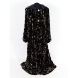 A Vintage full length velvet coat with hood. Black with floral design. Hand made by 'Forget Me