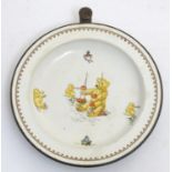 An early to mid 20thC Child's ceramic plate, decorated with illustrations of bears and dolls, with