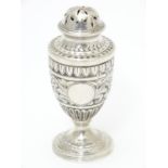 A Victorian silver caster / pepperette hallmarked London1886 maker Charles Stuart Harri. Approx 3