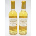 A pair of 375ml bottles of Castelnau de Suduiraut Sauternes 2013 white wine, each 9 1/2" tall Please