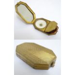 A French Art Deco gilt compact vanity by Houbigant, France, opening to reveal a mirror and two