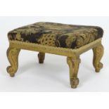 An / early 20thC footstool with an upholstered top above four cabriole legs terminating in