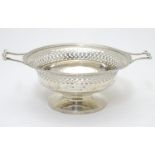 A silver twin handled pedestal dish with pierced decoration. Hallmarked Birmingham 1946 maker Mappin