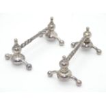 A pair of silver plate knife rests. 4"(2) Please Note - we do not make reference to the condition of