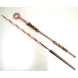 An African native tribal spear and walking stick, each with beadwork decoration, the stick with