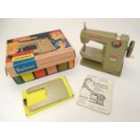 Toy: A 20thC Vulcan Countess child's sewing machine, hand operated. With original box and