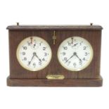 A 1920's / 30's oak cased chess clock by HAC Hamburg American Clock Company with crossed arrows