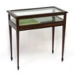 An early / mid 20thC vitrine / display cabinet with a glass lid above a small coin / medal drawer.