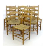 A set of six early / mid 20thC dining chairs with ash, oak and beech frames above envelope rush