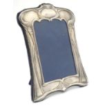 A photograph frame with silver surround having Art Nouveau style decoration. Hallmarked Sheffield