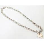 A silver chain necklace by Links of London, with engraved / inscribed heart pendant. Approx 16" long