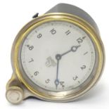 A car / automobile dashboard clock by Smiths. The circular dial set with Arabic numerals, with