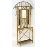 A late 19thC Meiji period hallstand of bamboo construction, having coat and hat hooks, a central