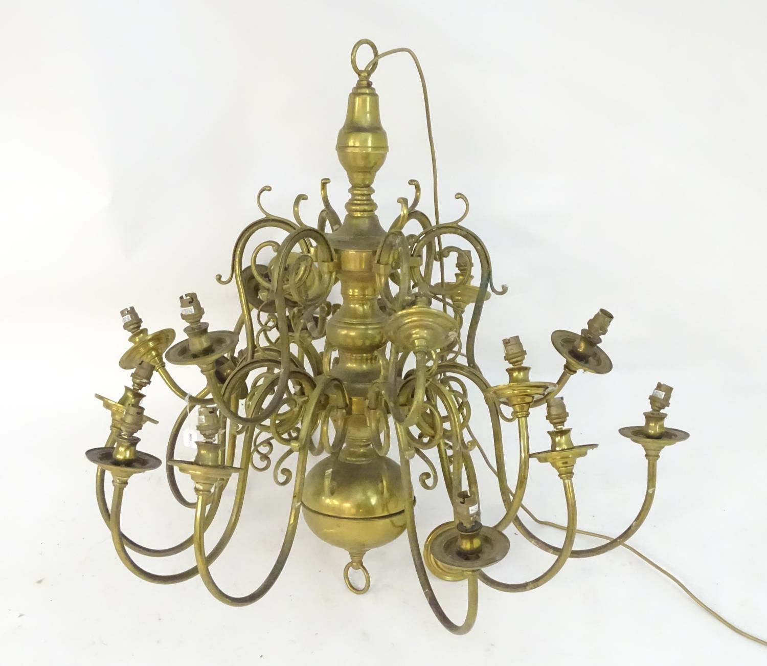 A mid to late 20thC two-tier pendant electrolier, with eighteen lights over two tiers, 36" tall