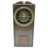 An Edwardian wall clock, the stained oak case housing a black and gilt numeral dial, 17 3/4" long, 7