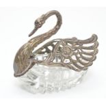 A novelty glass and dish with silver mounts formed as swan. 4 1/2" long Please Note - we do not make