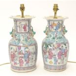 Two table lamps formed from Chinese ceramic vases of baluster form decorated with figures in an