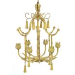 A chinoiserie Tole Peinte chandelier with faux bamboo detail and 6 candle branches. Approx 21"