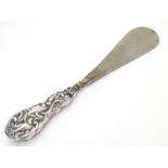 A silver handled shoe horn hallmarked Birmingham 1905. 9" long Please Note - we do not make
