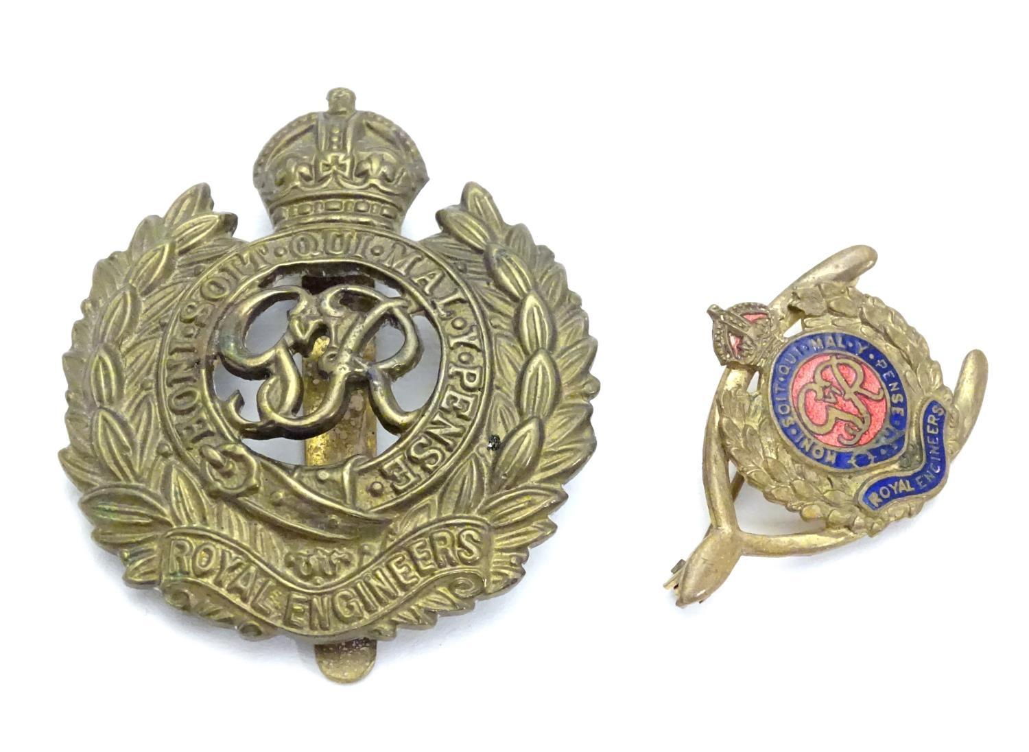 Militaria : a mid-20thC brass Royal Engineers cap badge and lapel badge, the largest 1 5/8" wide |(