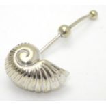 An unusual silver plated sugar sifter spoon formed as a Nautilus shell, with patent stamp PAT