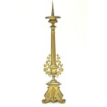 A 20thC large ecclesiastical gilded pricket candlestick with a fluted column flanked by applied vine