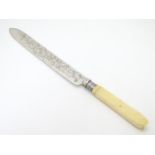 A cake knife with silver plate blade 13 1/2" long Please Note - we do not make reference to the