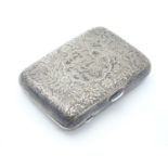 A Victorian silver cigarette case with engraved floral and foliate decoration. Hallmarked Birmingham
