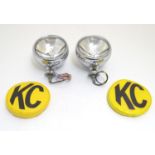 A pair of KC Hilites chromium automotive spotlights with covers, each 6" wide Please Note - we do