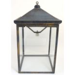 An early 20thC large hanging light of lantern form with four glass panels. The whole Approx 32" high