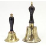 Two early 20thC brass hand bells with ebonised and turned handles. Largest approx. 7" high (2)