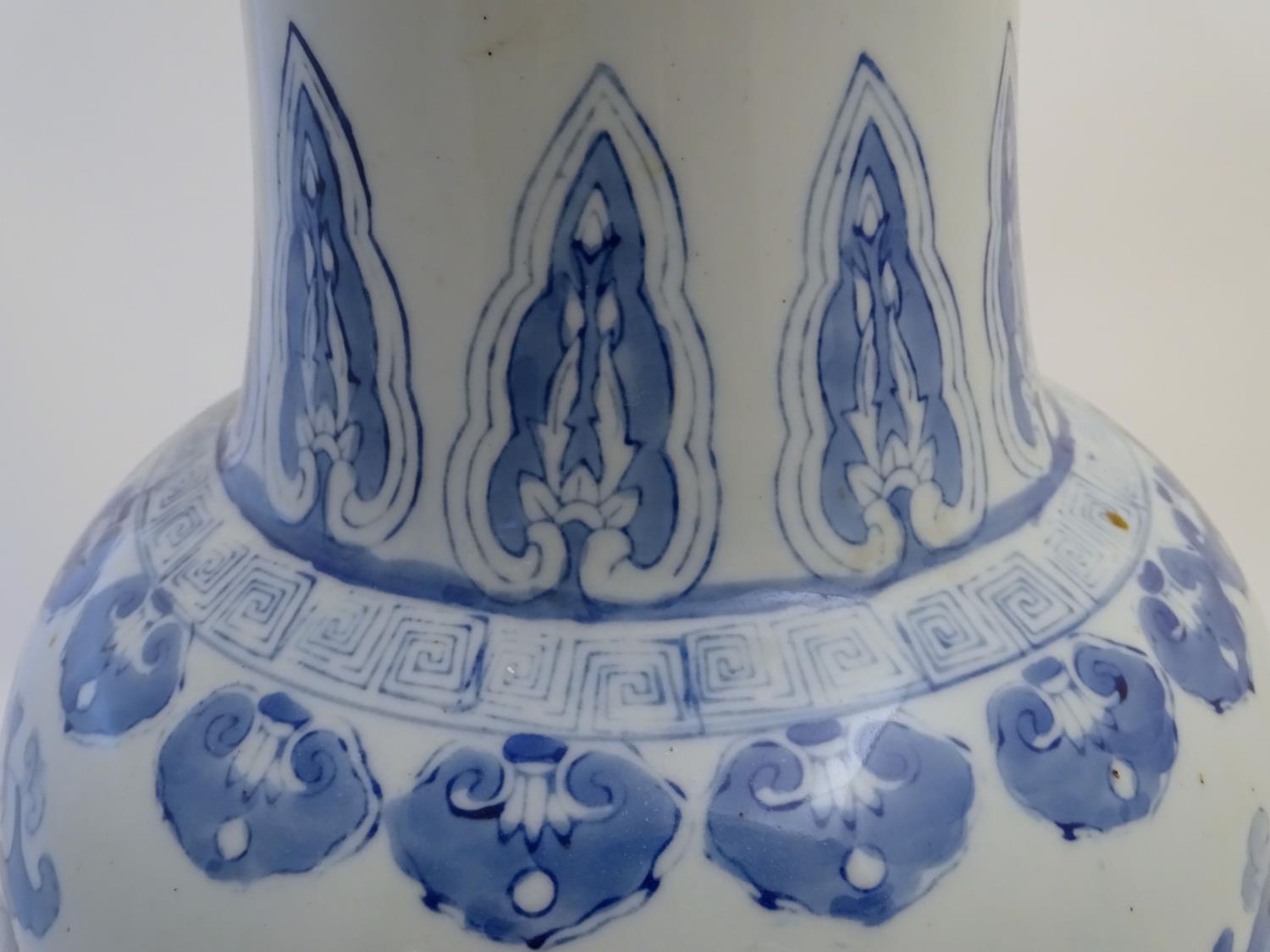 A large Chinese blue and white vase decorated with flowers, foliage and a stylised phoenix and - Image 8 of 10