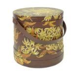 A 20thC wooden container of cylindrical form with a swing handle and hand painted floral and foliate