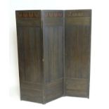 An early 20thC Art Deco oak folding screen with butterfly decoration. 68" high. Please Note - we