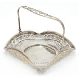 An American Sterling silver swing-handled bonbon dish of square form with pierced decoration.