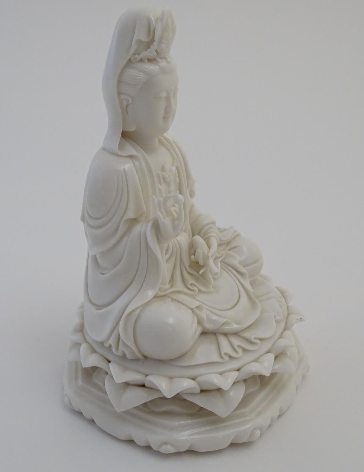 A Chinese blanc de chine figure depicting Guanyin seated on a lotus flower base. Approx. 7 1/2" high - Image 3 of 16