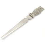 A silver plate letter opener / paper knife. The handle formed as an owl. 7" high Please Note - we do
