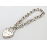 A chain link bracelet with silver heart shaped padlock style clasp marked 'Love' ' Please return