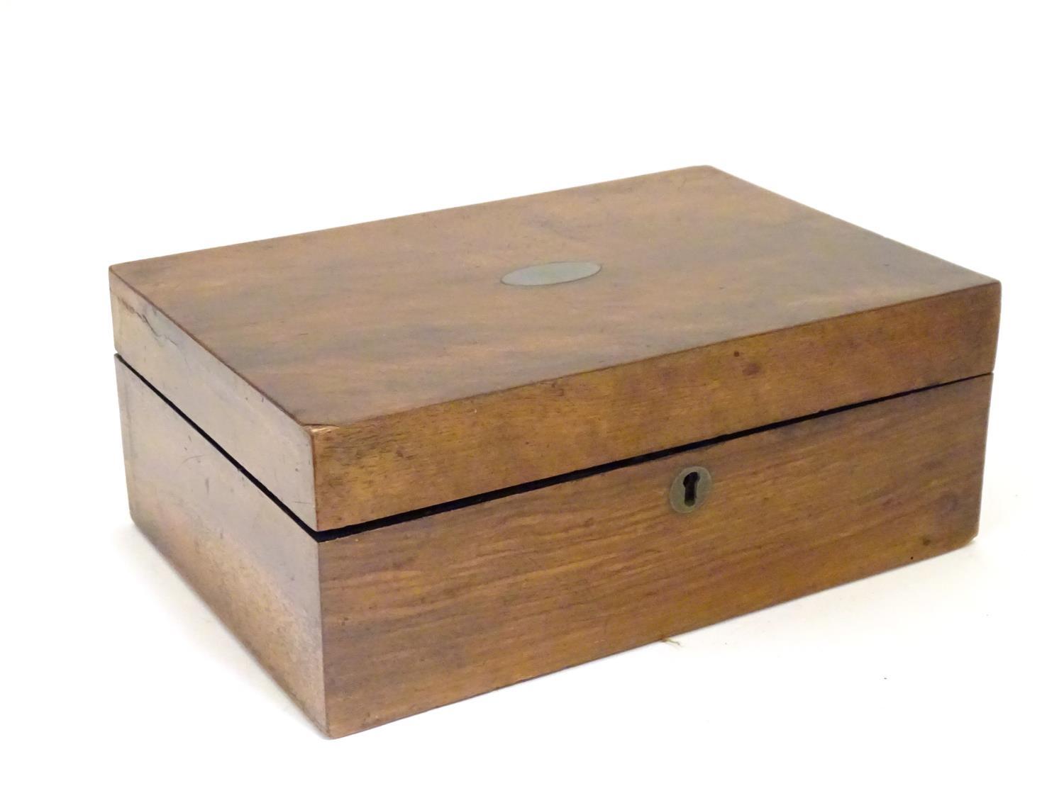 A 19thC walnut jewellery box with fitted lift out tray within. Approx. 3 3/4" high x 9 3/4" long x 6