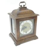 A 20thC Smiths walnut cased bracket clock in walnut case with silvered Roman chapter ring , hammered