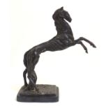 A 20thC bronze sculpture of a rearing horse on a rectangular base. Approx. 18" high Please Note - we