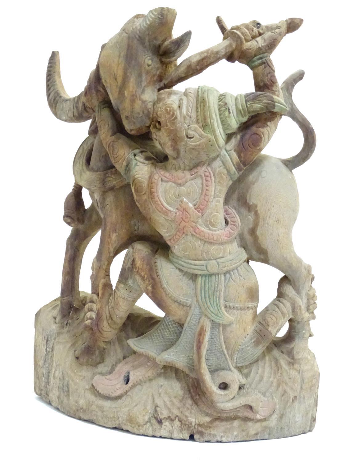 An Asian 20thC carved wooden sculpture modelled as a bull and warrior with polychrome decoration. - Image 7 of 8
