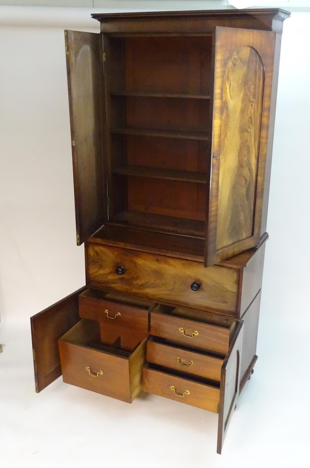 A mid 19thC mahogany secretaire bookcase, having a moulded cornice above two flame mahogany panelled - Bild 4 aus 8